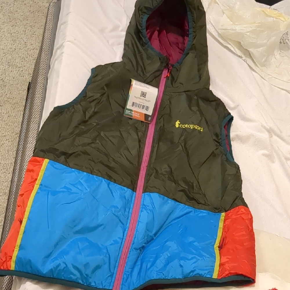 Cotopaxi Colorful Hooded Vest with Blue and Red Accents